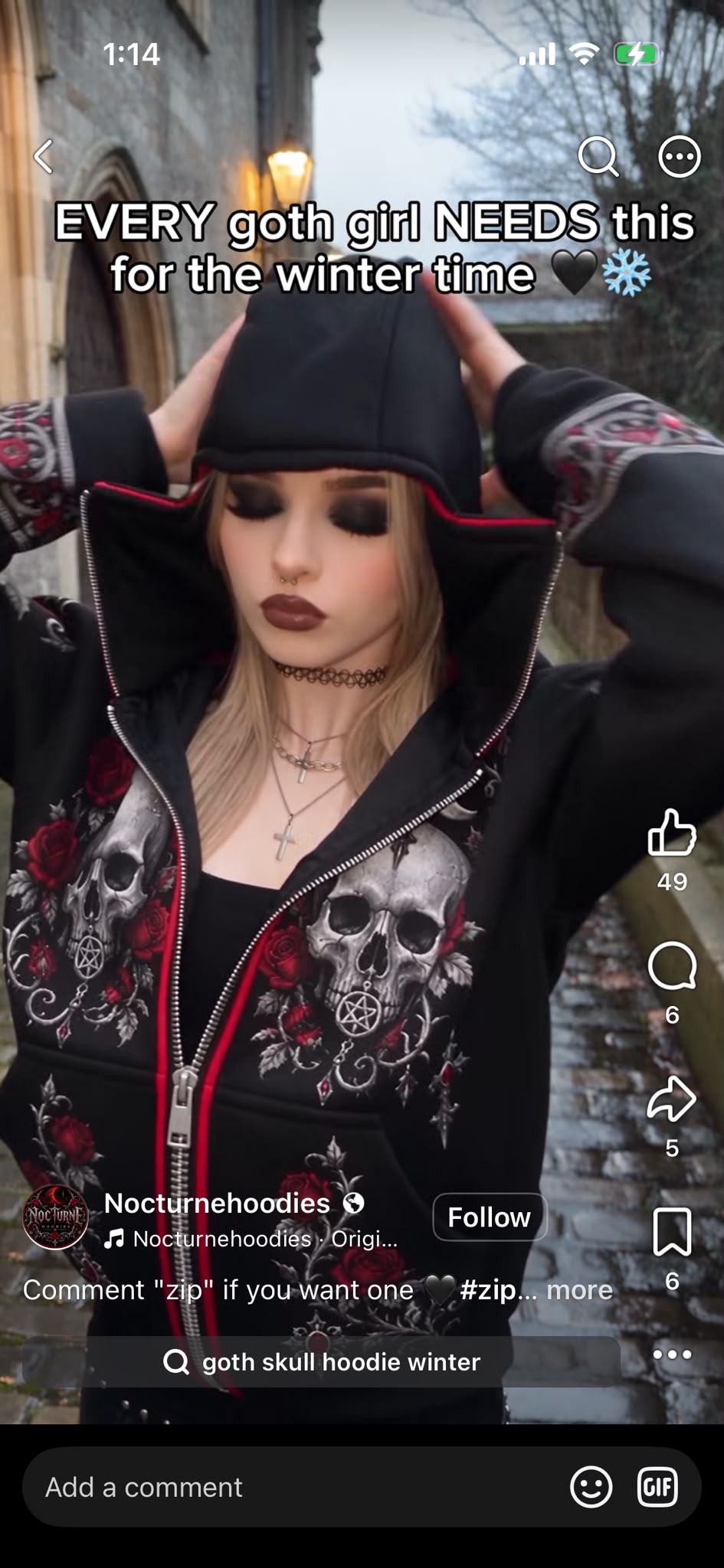 Crimson Rose hoodie worn with the mask unzipped